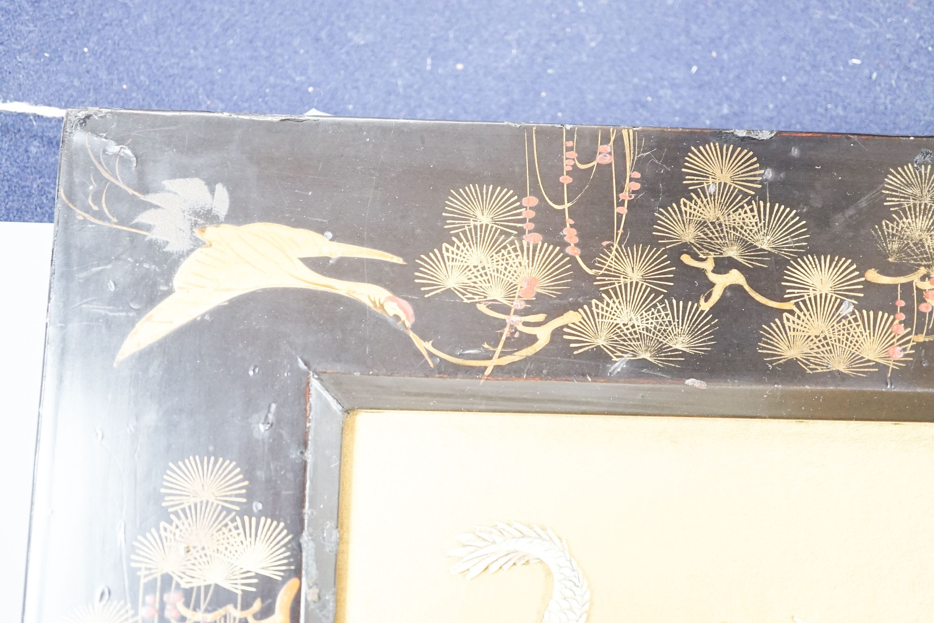A Japanese bone ‘dragon’ and lacquer framed panel, early 20th century, 31 x 37 cm